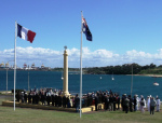 WEB At monument with flags